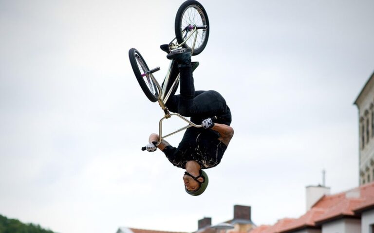 Photo of BMX rider mid-trick in the air